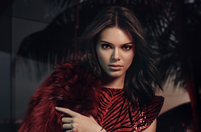 Kendall Jenner in red sequined dress and fur stole