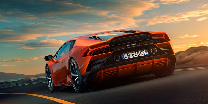 Orange Lamborghini Huracan Evo on a road