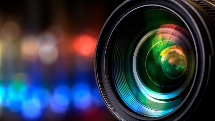 Camera lens with colorful bokeh background