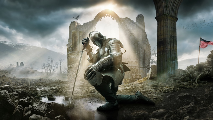 Knight in Armor Kneeling with Sword in Ruins
