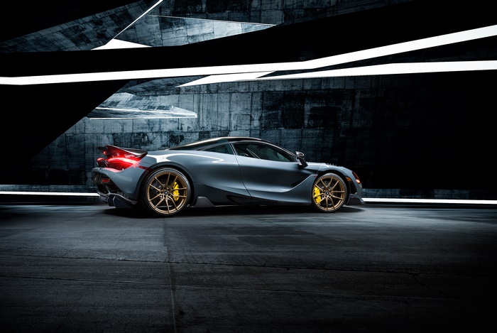 McLaren 720S supercar in a dark, modern architectural space