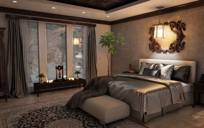 Bedroom with a bed, windows, and ornate mirror