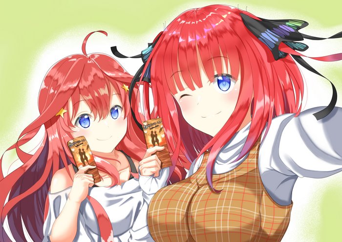 Itsuki Nakano and Nino Nakano holding chocolate bars