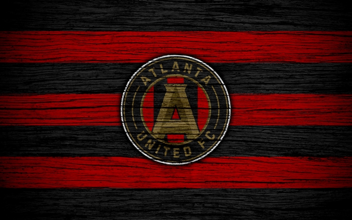Atlanta United FC logo on red and black striped background