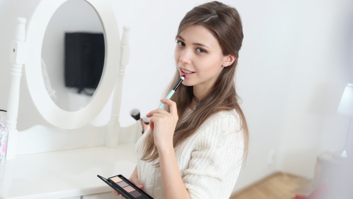 Mila Azul Applying Makeup by Vanity Mirror