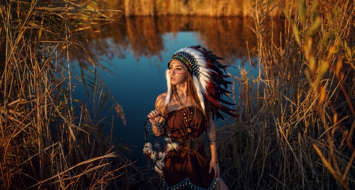 Woman in Native American Headdress with Dreamcatcher