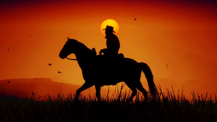 Cowboy on Horse Silhouette at Sunset