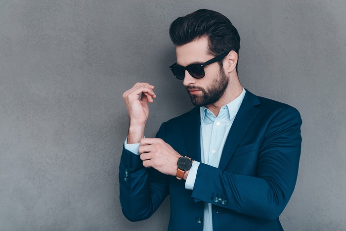 Man in Suit Adjusting Cuff