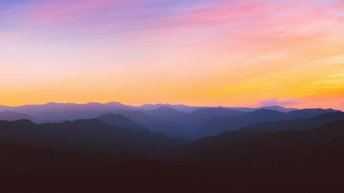 Mountain range at sunset with colorful sky