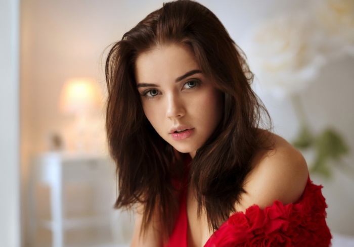 Brunette Woman with Blue Eyes Wearing Red