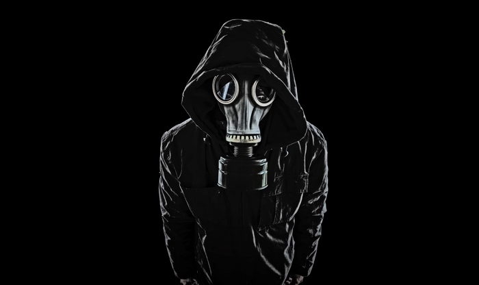 Person in gas mask and hood