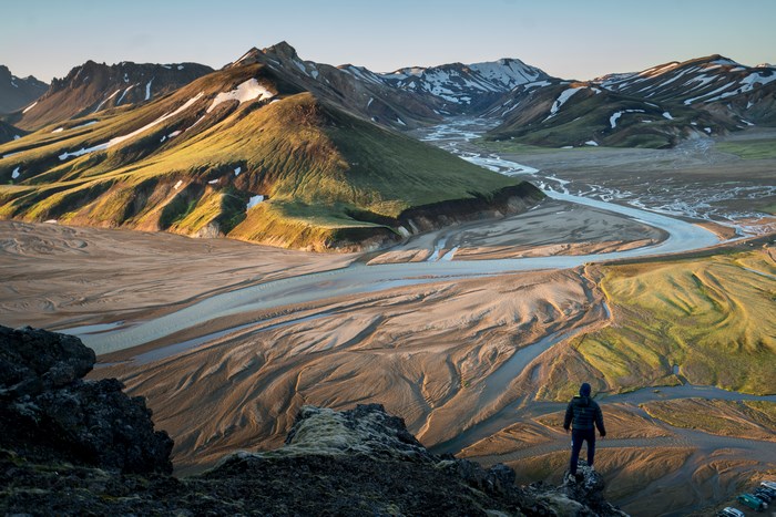 Person overlooking Landmannalaugar river valley in Iceland