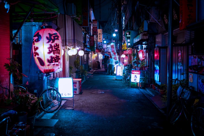 Night alley with lanterns and bicycles in Japan