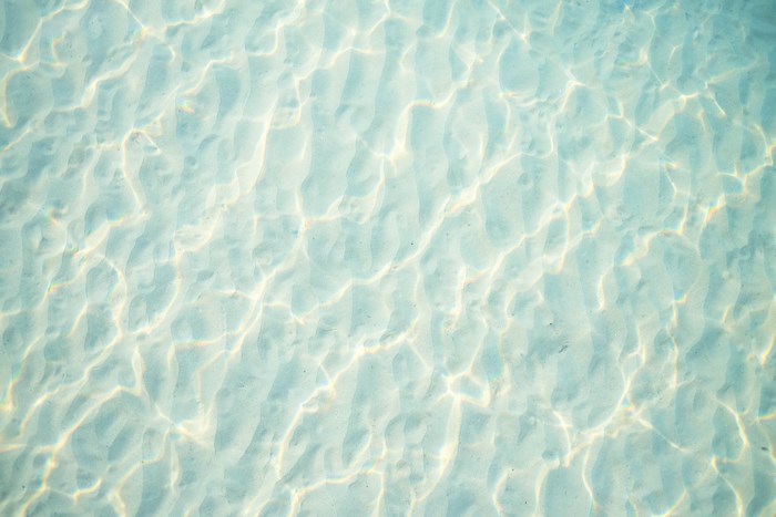 Underwater sand ripples with light patterns