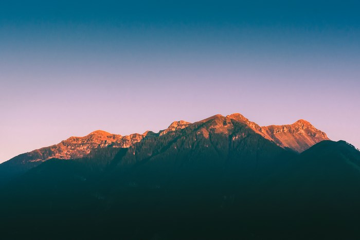 Sunlit Mountain Range at Sunrise