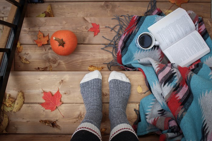 Cozy Autumn Scene with Pumpkin, Book, and Coffee