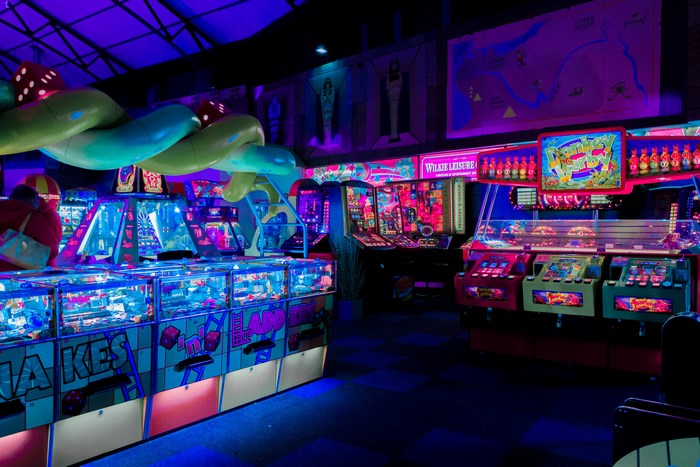 Amusement arcade with slot machines and neon lights