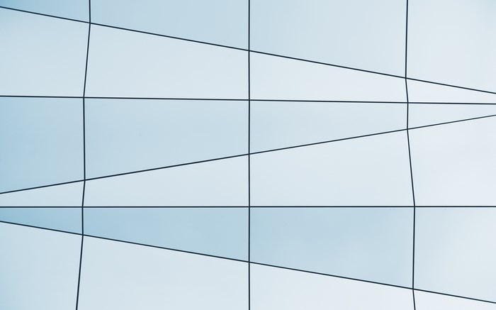 Modern building facade with geometric glass panels
