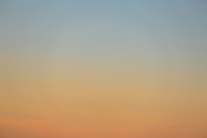 Sky gradient at dawn or dusk with blue and orange hues