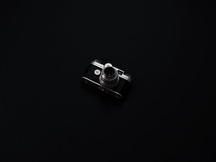 Vintage analog camera on a black background