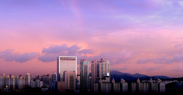 Sunset Over Modern Seoul Cityscape with Pink Sky