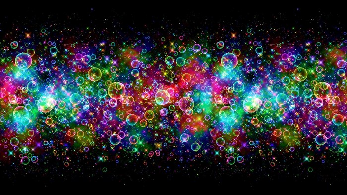 Rainbow bubbles and stars on black background