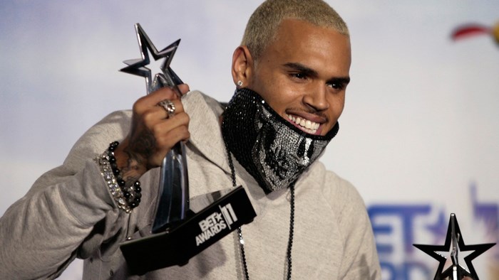 Chris Brown holding BET Awards trophy