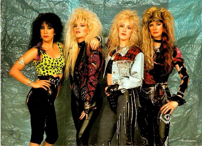 Vixen band members posing for a photo