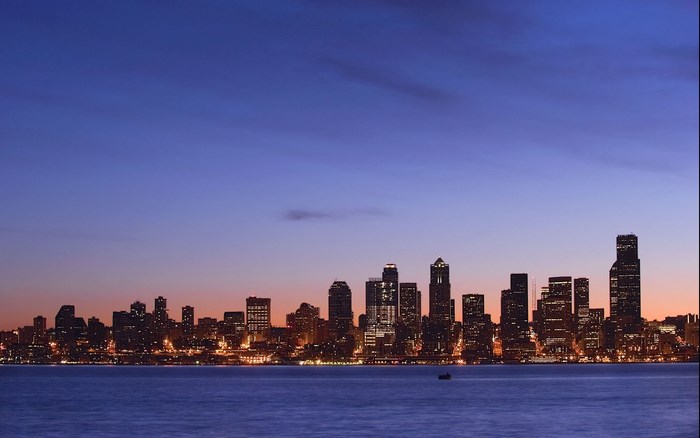 City skyline at dusk over water