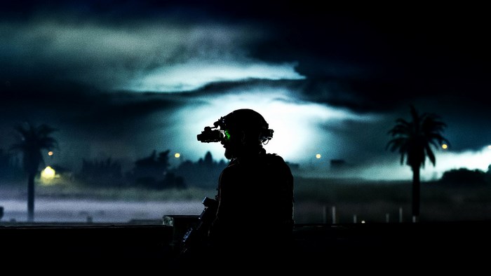 Soldier with night vision goggles at night