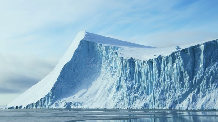 Massive iceberg with sheer ice cliffs