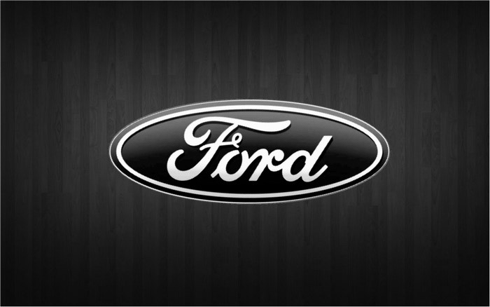 Ford logo on a dark wood background