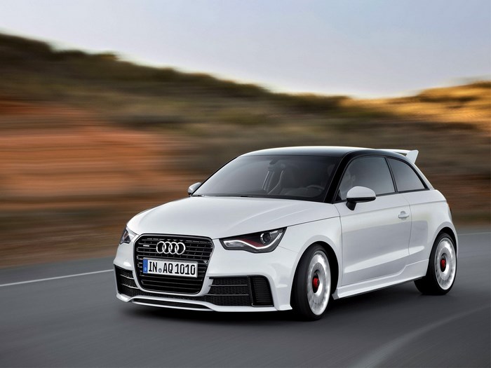 White Audi A1 Quattro driving on a road