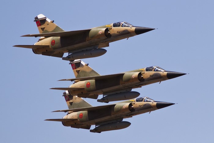 Three Dassault Mirage F1 fighter jets flying in formation