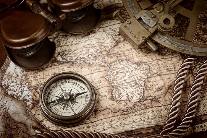 Vintage Compass and Sextant on Old Map