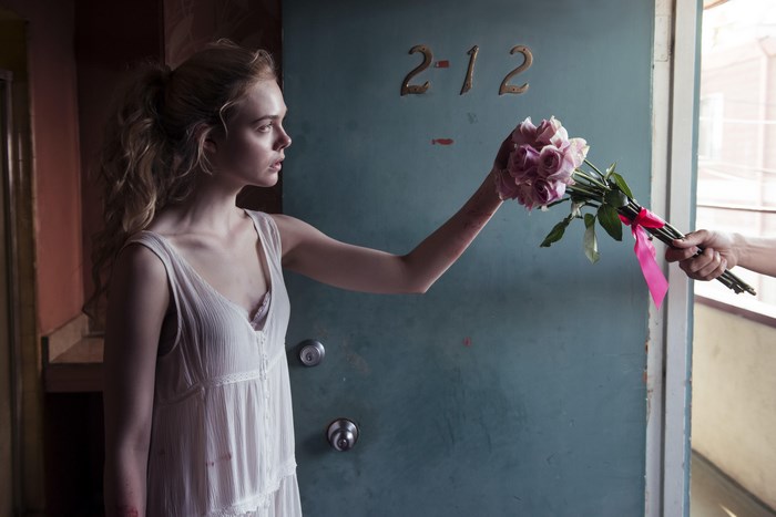 Elle Fanning receiving flowers at door