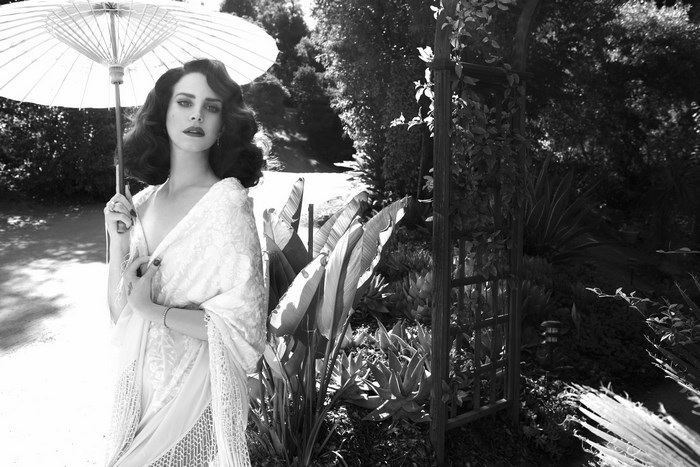 Lana Del Rey with Parasol in Garden