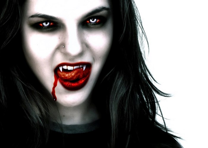 Vampire with fangs and blood
