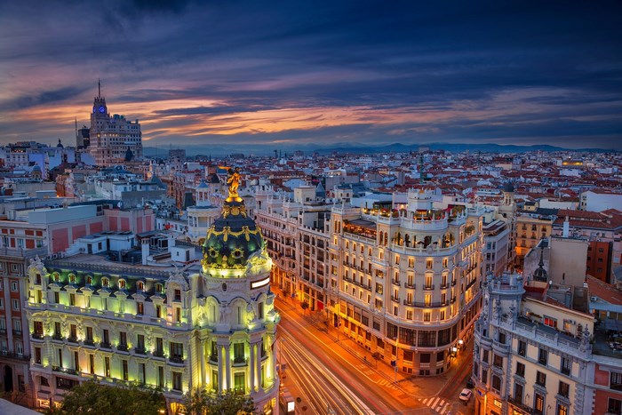 Madrid cityscape at dusk with illuminated buildings