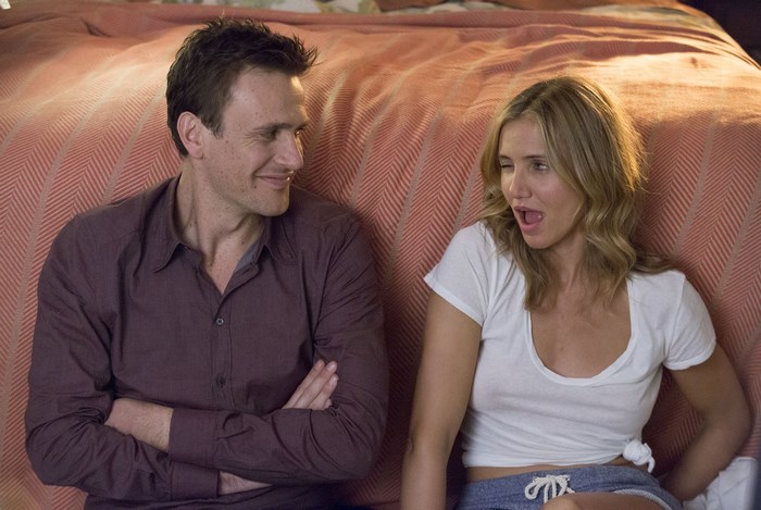 Casual conversation between man and woman on sofa