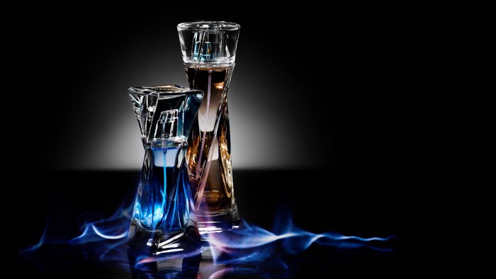 Elegant Perfume Bottles with Blue Smoke