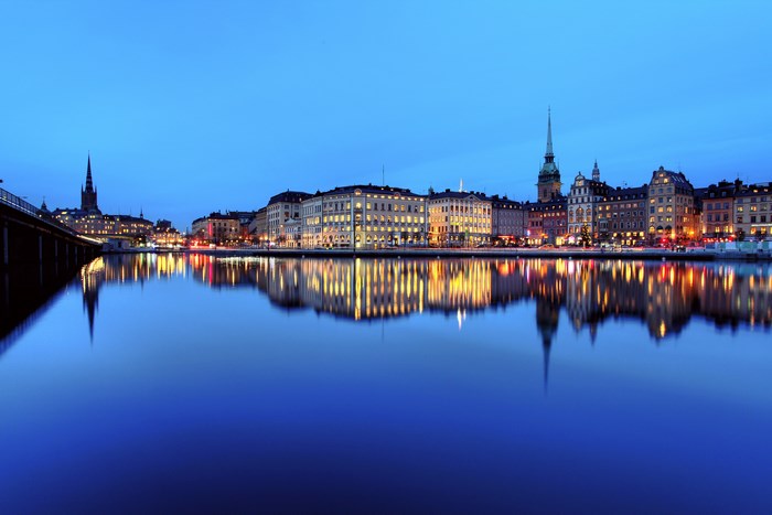 Stockholm cityscape with water reflections at dusk