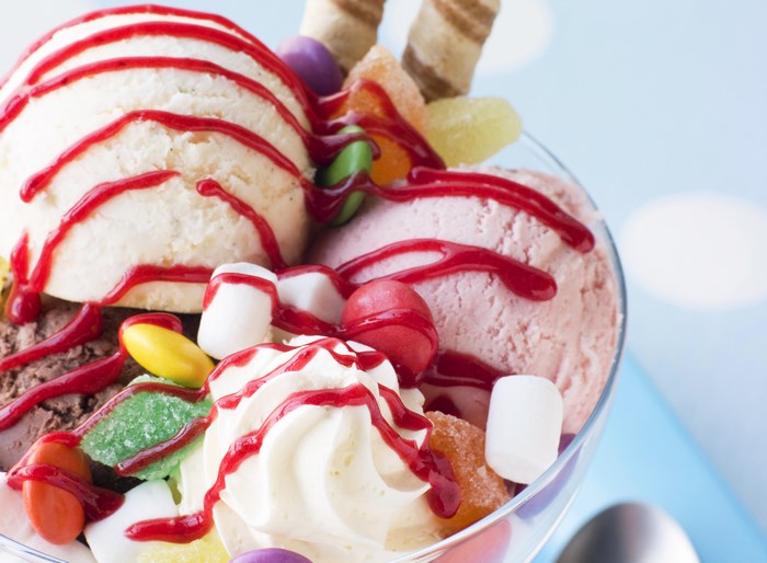 Ice cream sundae with candy and syrup