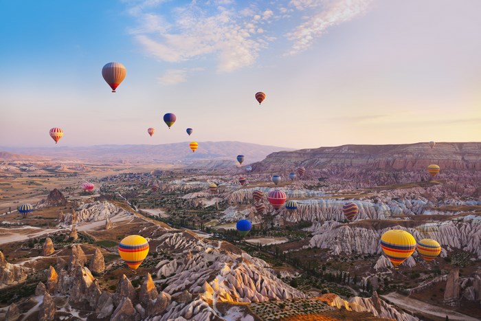 Hot air balloons over Cappadocia at sunrise