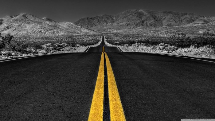 Desert road with mountains