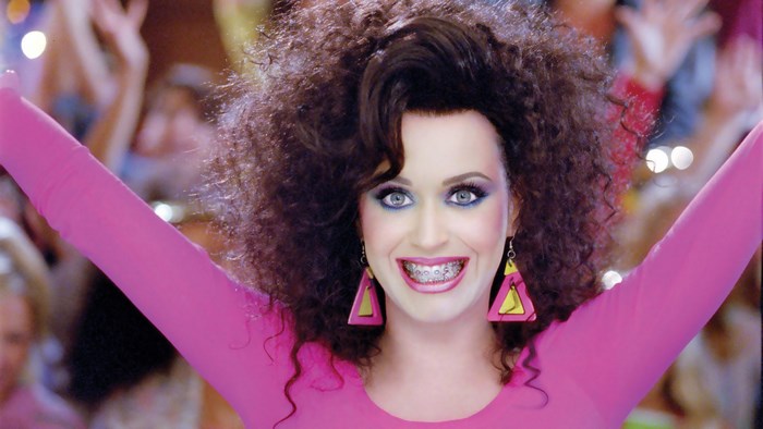 Katy Perry in a pink outfit with big hair