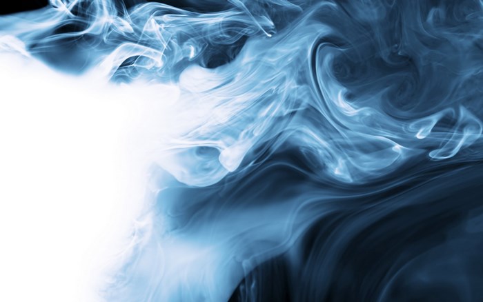 Blue smoke swirls on a dark background