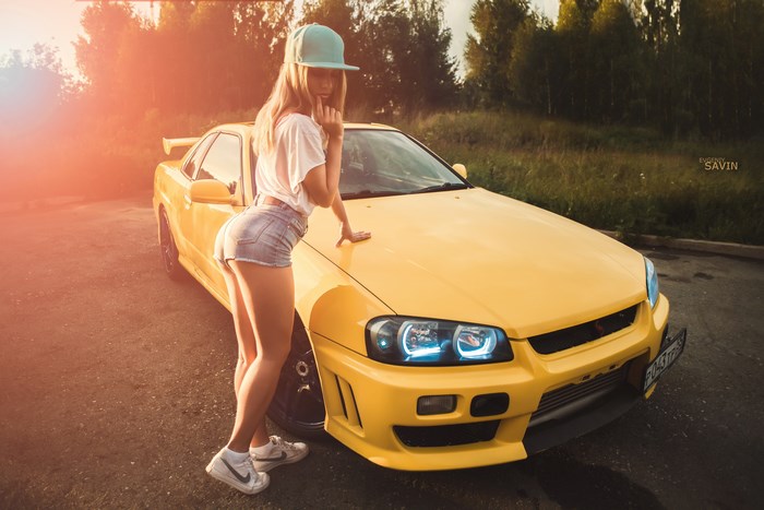 Girl Posing with Yellow Sports Car at Sunset