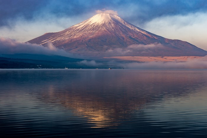 Mount Fuji reflected in a lake at sunrise