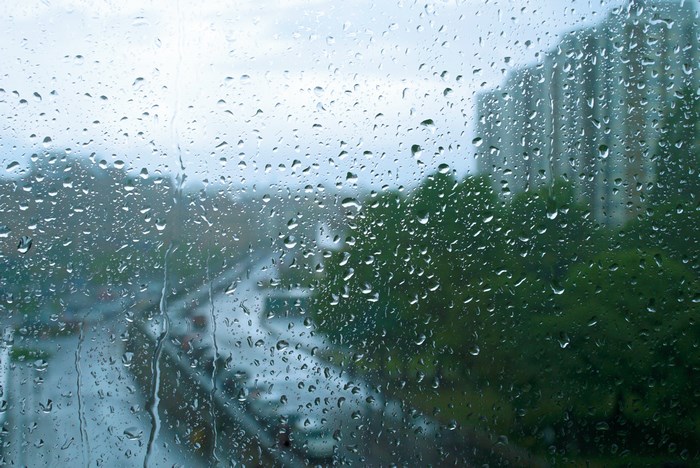 Raindrops on Window Overlooking City Street